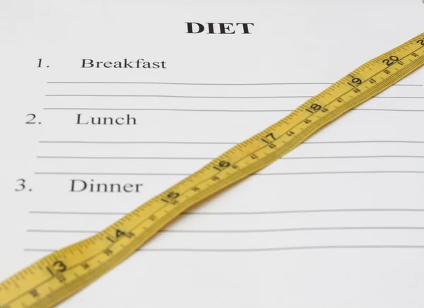 Papier met dag dieet plan, pen en maatregel tape — Stockfoto