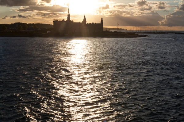 Castle in sunset sea — Stock Photo, Image