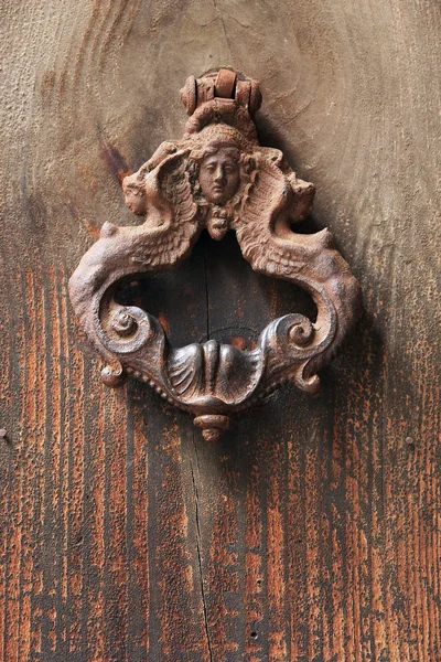 Old roman door knocker in a form of virgo deity — Stock Photo, Image