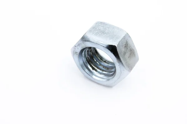 Shining big steel metal hex nut with female thread on white back — Stock Photo, Image