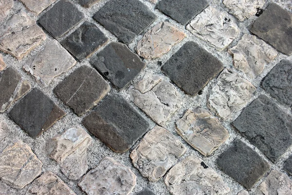 Ancient roman dilapidated small square stone paving in Rimini, I — Stock Photo, Image