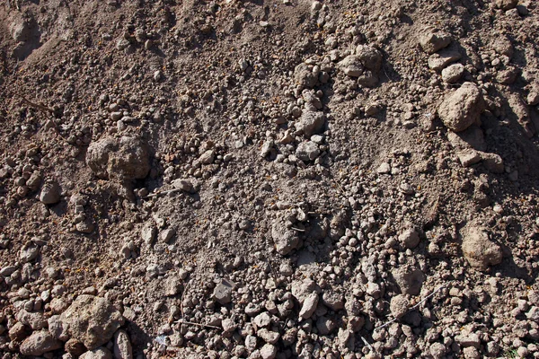 Σωρός ανασκαμμένο γκρι καφέ χώμα και χώμα closeup προσκήνιο Εικόνα Αρχείου