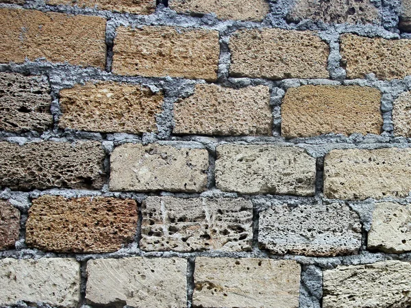 Texture of old dilapidated shabby coquina masonry wall foregroun — Stock Photo, Image