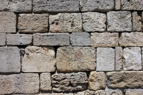 Texture of old dilapidated shabby sandstone masonry of square sa — Stock Photo, Image