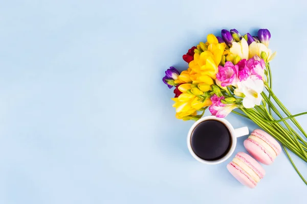 Cup of coffee, cakes and flowers. Coffee and flowers copy space