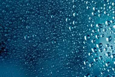 condensation drops on glass with blue backgroung clipart