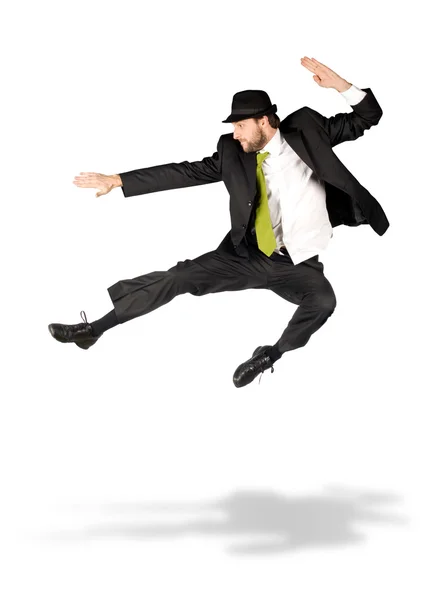 Gelukkig zakenman met groene stropdas springen geïsoleerd op wit — Stockfoto