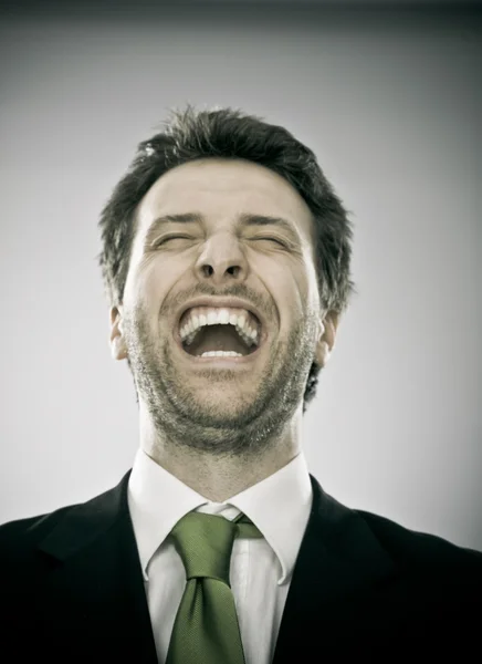 Sorridente feliz empresário com gravata verde isolado no branco — Fotografia de Stock