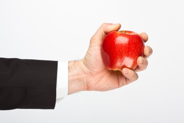 gri izole Kırmızı elma tutan işadamı el