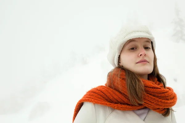 Beautiful relaxed woman with red scarf in a snowy landscape portrait — Stock Photo, Image