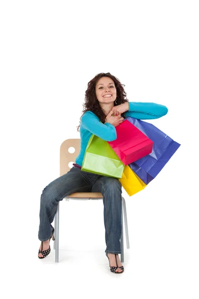 Felice bella giovane donna mostra negozio borsa isolata su bianco — Foto Stock