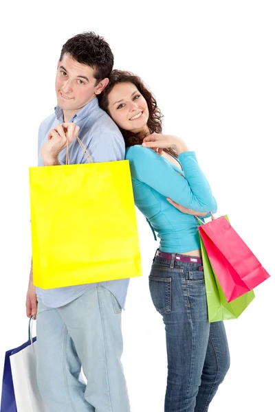 Joven hermosa pareja en el amor con bolso de la tienda aislado en blanco — Foto de Stock