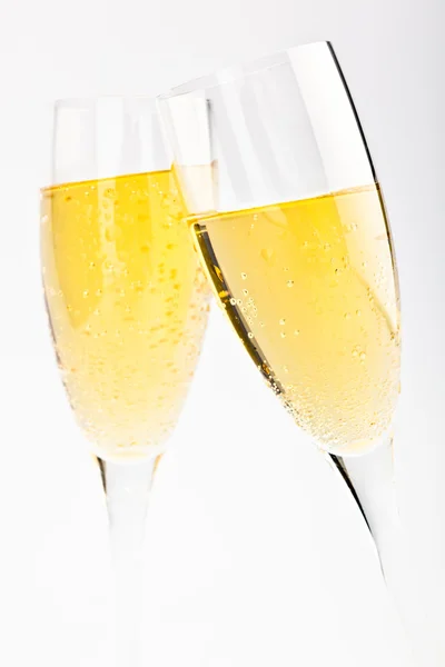 elegant champagne gold glasses isolated on grey