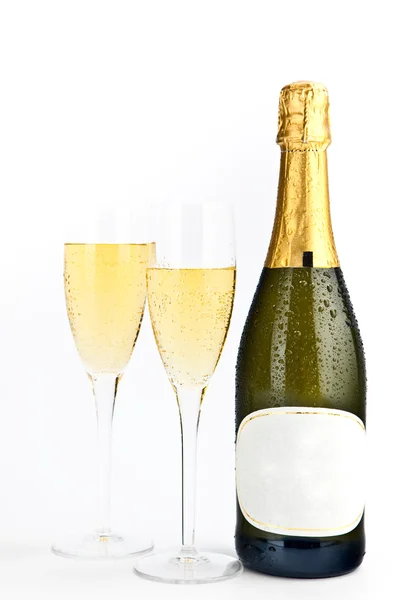 Champagne gold bottle with glasses isolated on white Stock Image