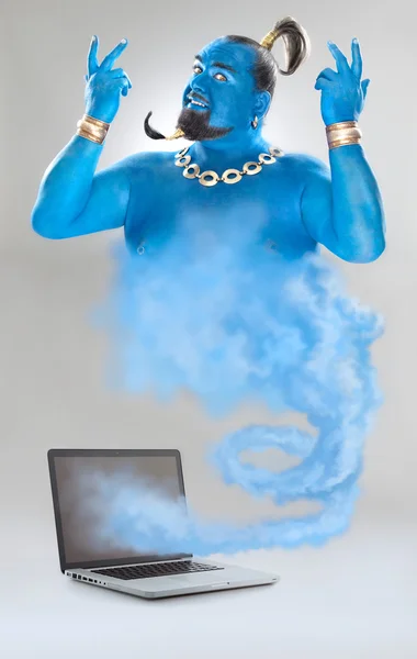 Genie lampan med rök från laptop isolerad på grå — Stockfoto