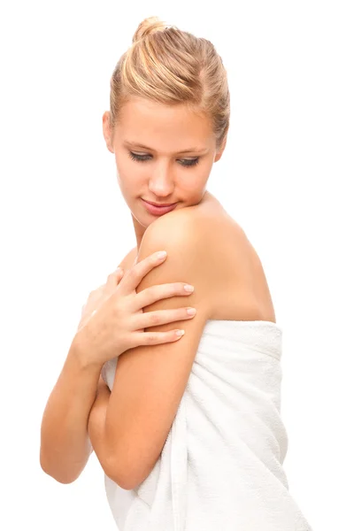 Beautiful blonde woman covered with towel isolated on white — Stock Photo, Image