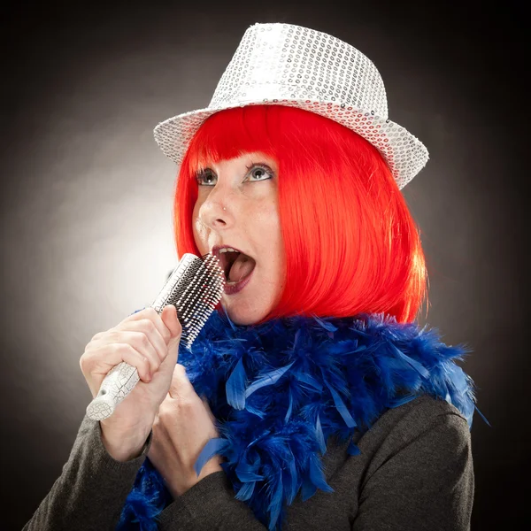 Readhead crazy singer portrait with hat on a grey background — Stock Photo, Image