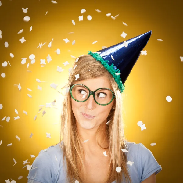 young beautiful happy blonde girl at party with glasses portrait on yellow background