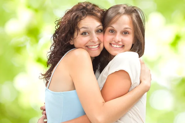 Beautiful young girl couple hug smile outdoor Royalty Free Stock Images