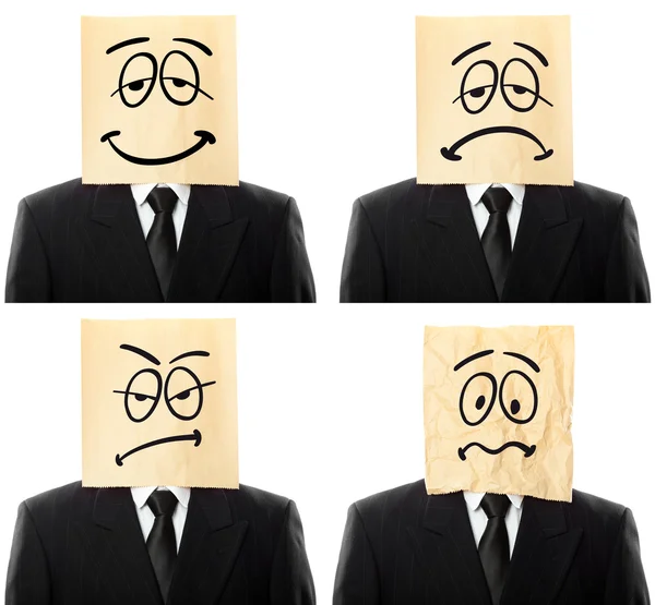 Empresário conceitual com saco de papel com expressão diferente na cabeça isolada em branco — Fotografia de Stock