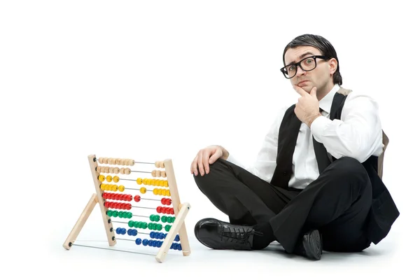 Grappige nerd man met een abacus geïsoleerd op wit — Stockfoto