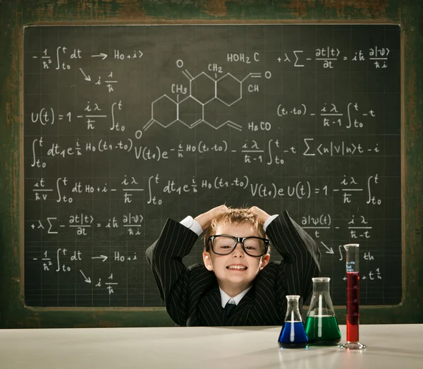 Young elegant clever chemistry student or scientist serious pose with blackboard — Stock Photo, Image