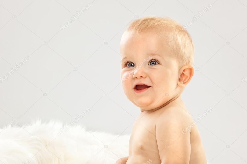 Beautiful Blonde Hair Blue Eyes Baby In A White Room Stock Photo Beautiful Blonde Hair Blue Eyes Baby In A White Room Stock Image