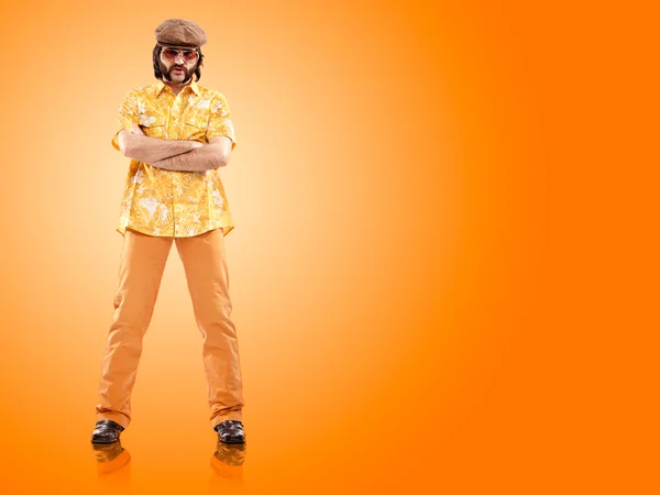 1970s vintage man stand with orange background — Stock Photo, Image