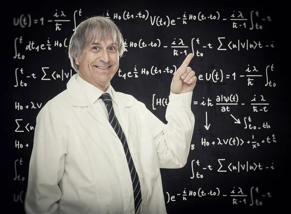 mad caucasian professor or scientist point finger on blackboard full of formula