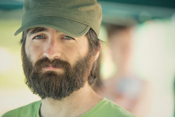 Peaceful beard soldier with hat outdoor — Stock Photo, Image