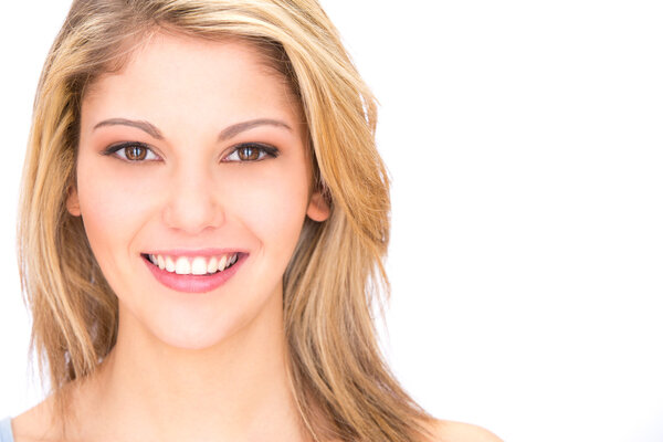 young blonde smiling woman portrait with perfect teeth isolated on white