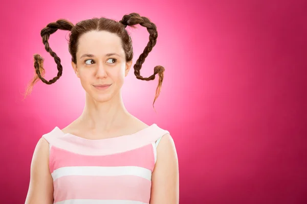 Mad funny women with curvy pigtail isolated on pink — Stock Photo, Image