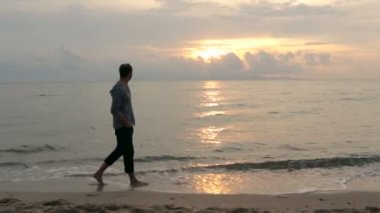 Man walk on beach