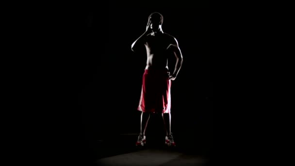 Athletic man isolated on black — Stock Video