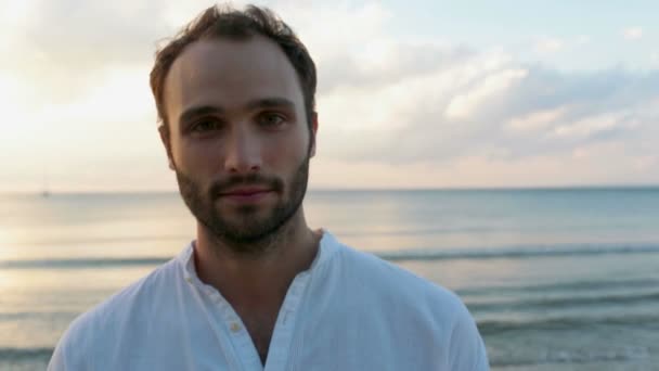 Bearded man on beach seaside at sunset — Stock Video