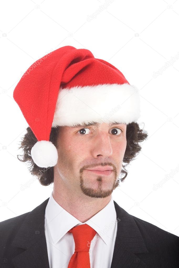 businessman with santa hat looking at camera