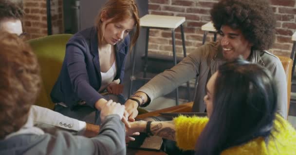 Closeup view of many different multiethnic and multicultural hands together united in support. Teamwork and friendship. — Stock Video