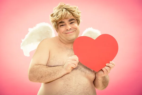 Happy cupid gives love heart for valentine day — Stock Photo, Image