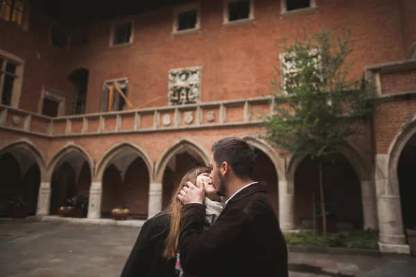 Loving couple posing in the old town — Stock Photo, Image