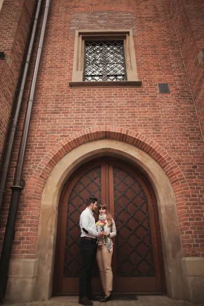 Loving couple posing in the old town — Stock Photo, Image