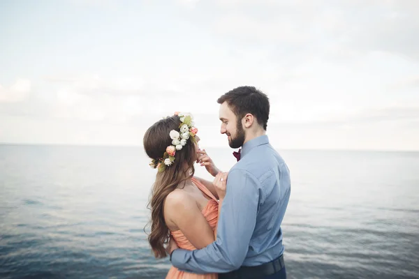 Beautiful loving couple, pride with long dress walking on pier — Stock Photo, Image