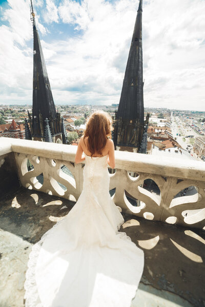 Beautiful luxury bride on the balcony with perfect landscape