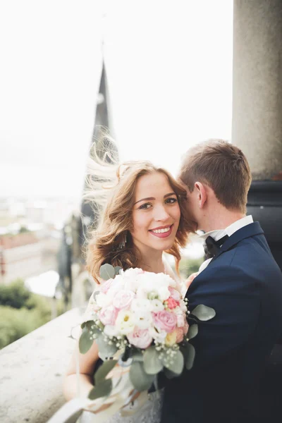 Gorgeous wedding couple walking in the old city of Lviv — Stock Photo, Image