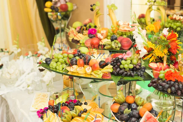 Various sweet sliced fruit on a buffet table