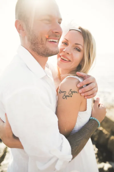 Happy just married young wedding couple celebrating and have fun at beautiful beach sunset — Stock Photo, Image