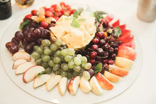 Different fresh fruits on wedding buffet table — Stock Photo, Image