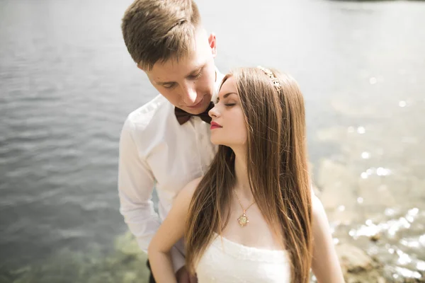 Kissing wedding couple in spring nature close-up portrait — Stock Photo, Image