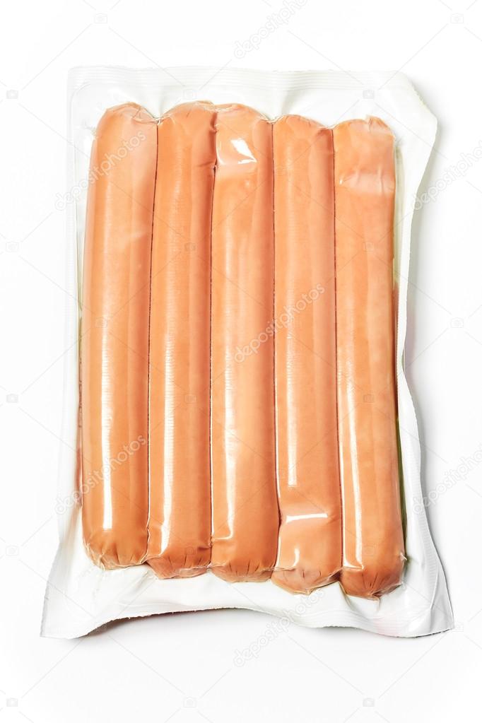 Pack of raw hot dogs in plastic packaging