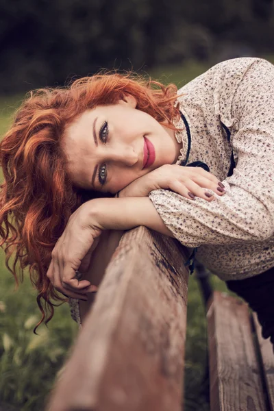 Redhead girl in park — Stock Photo, Image