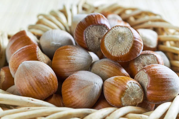 Hazelnuts on wooden background Royalty Free Stock Photos